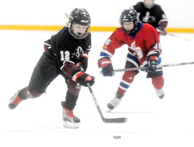 Kids playing hockey